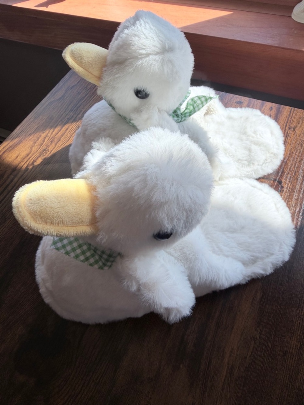 Duck/Goose slippers with green & white gingham ribbon at neck.